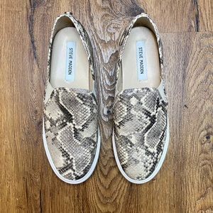 Faux snakeskin Steve Madden slip on shoes.